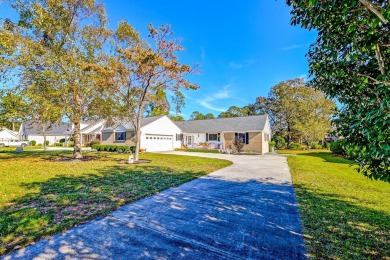 What an incredible find! Nestled on a spacious lot along Hole 12 on Santee-Cooper Country Club in South Carolina - for sale on GolfHomes.com, golf home, golf lot