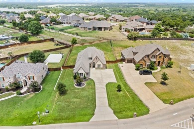 Welcome to this immaculate former model home, nestled on a on The Golf Club at Resort Eagle Mountain Lake in Texas - for sale on GolfHomes.com, golf home, golf lot