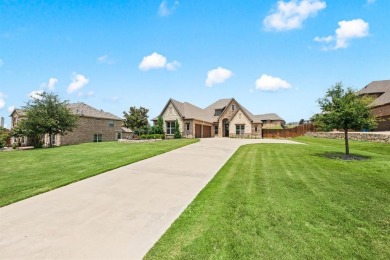 Welcome to this immaculate former model home, nestled on a on The Golf Club at Resort Eagle Mountain Lake in Texas - for sale on GolfHomes.com, golf home, golf lot