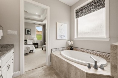 Welcome to this immaculate former model home, nestled on a on The Golf Club at Resort Eagle Mountain Lake in Texas - for sale on GolfHomes.com, golf home, golf lot
