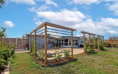 Discover the perfect blend of mid-century charm and modern on Venice East Golf Club in Florida - for sale on GolfHomes.com, golf home, golf lot