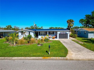 Discover the perfect blend of mid-century charm and modern on Venice East Golf Club in Florida - for sale on GolfHomes.com, golf home, golf lot