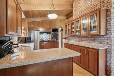 This classic mid-century modern home makes a dramatic statement on Brookview Golf Course - Brookview in Minnesota - for sale on GolfHomes.com, golf home, golf lot
