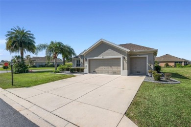 Right out of a magazine, this stunning  HANOVER sits on a 1/3 on Eagle Ridge At Spruce Creek Country Club in Florida - for sale on GolfHomes.com, golf home, golf lot