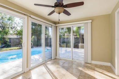 This beautifully updated three-bedroom, two-bathroom pool home on Largo Golf Course in Florida - for sale on GolfHomes.com, golf home, golf lot