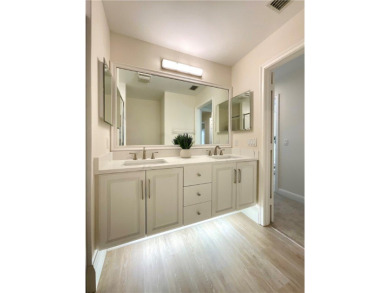 Delightful transformation of a lakefront 2/2 condo in Vero's on Oak Harbor Country Club in Florida - for sale on GolfHomes.com, golf home, golf lot