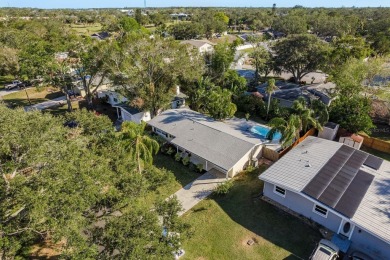 This beautifully updated three-bedroom, two-bathroom pool home on Largo Golf Course in Florida - for sale on GolfHomes.com, golf home, golf lot