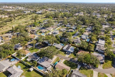 This beautifully updated three-bedroom, two-bathroom pool home on Largo Golf Course in Florida - for sale on GolfHomes.com, golf home, golf lot