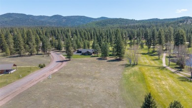 Located just outside the quaint town of Seeley Lake, this on Double Arrow Lodge in Montana - for sale on GolfHomes.com, golf home, golf lot
