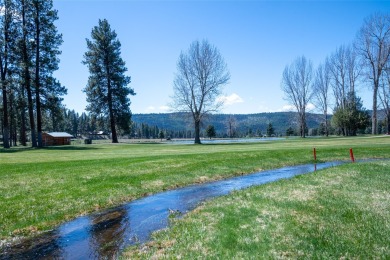 Located just outside the quaint town of Seeley Lake, this on Double Arrow Lodge in Montana - for sale on GolfHomes.com, golf home, golf lot