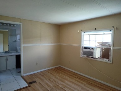 CALLING ALL FLIPPERS**LAKESIDE FIXER UPPER** NEEDS A/C AND A on Vista Plantation Golf Club in Florida - for sale on GolfHomes.com, golf home, golf lot