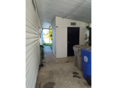 CALLING ALL FLIPPERS**LAKESIDE FIXER UPPER** NEEDS A/C AND A on Vista Plantation Golf Club in Florida - for sale on GolfHomes.com, golf home, golf lot