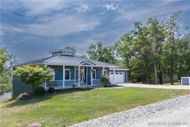 This charming Craftsman-style home, nestled in a prime location on Tan-Tar-A Golf Club in Missouri - for sale on GolfHomes.com, golf home, golf lot