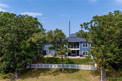 This charming Craftsman-style home, nestled in a prime location on Tan-Tar-A Golf Club in Missouri - for sale on GolfHomes.com, golf home, golf lot