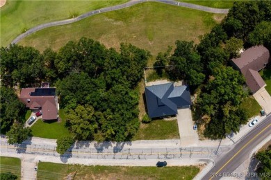 This charming Craftsman-style home, nestled in a prime location on Tan-Tar-A Golf Club in Missouri - for sale on GolfHomes.com, golf home, golf lot