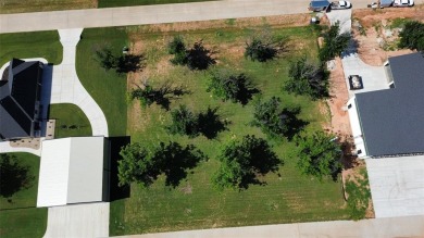 Fly in and see this ready-to-build lot in the highly on Pecan Plantation Country Club in Texas - for sale on GolfHomes.com, golf home, golf lot