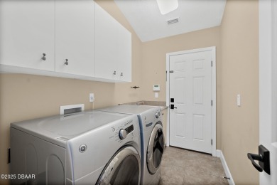 Located within the highly sought-after, guard-gated community of on Plantation Bay Golf and Country Club in Florida - for sale on GolfHomes.com, golf home, golf lot