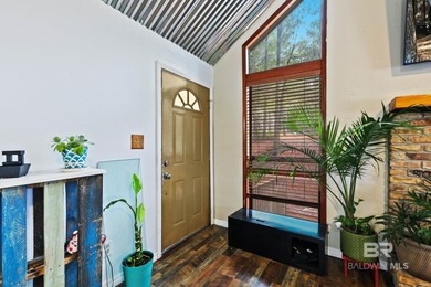 Looking for a home that feels like a cozy retreat tucked away in on Lake Forest Yacht and Country Club in Alabama - for sale on GolfHomes.com, golf home, golf lot