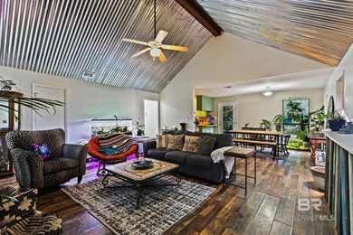 Looking for a home that feels like a cozy retreat tucked away in on Lake Forest Yacht and Country Club in Alabama - for sale on GolfHomes.com, golf home, golf lot