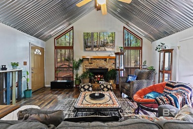 Looking for a home that feels like a cozy retreat tucked away in on Lake Forest Yacht and Country Club in Alabama - for sale on GolfHomes.com, golf home, golf lot