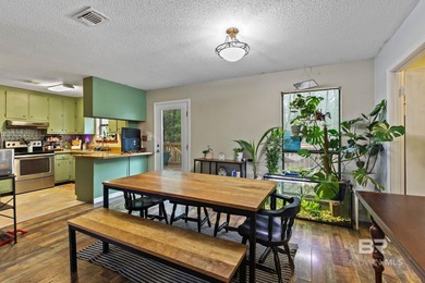 Looking for a home that feels like a cozy retreat tucked away in on Lake Forest Yacht and Country Club in Alabama - for sale on GolfHomes.com, golf home, golf lot