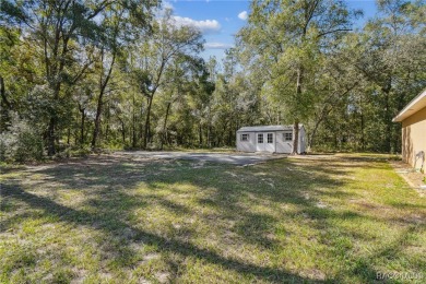 Tucked away on a VERY INTIMATE and ISOLATED.55-acre corner lot on Citrus Springs Country Club in Florida - for sale on GolfHomes.com, golf home, golf lot