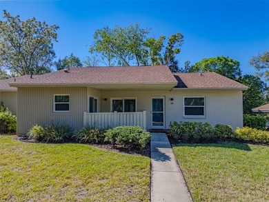 This beautifully updated 3-bedroom, 2-bath single-family home is on East Lake Woodlands Country Club in Florida - for sale on GolfHomes.com, golf home, golf lot