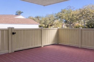 This beautifully updated 3-bedroom, 2-bath single-family home is on East Lake Woodlands Country Club in Florida - for sale on GolfHomes.com, golf home, golf lot