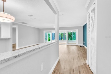 This beautifully updated 3-bedroom, 2-bath single-family home is on East Lake Woodlands Country Club in Florida - for sale on GolfHomes.com, golf home, golf lot