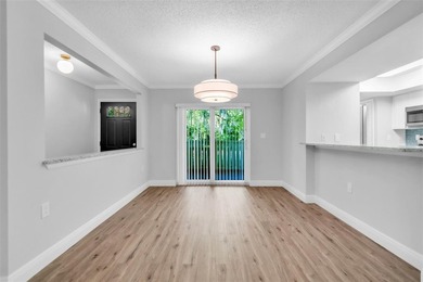 This beautifully updated 3-bedroom, 2-bath single-family home is on East Lake Woodlands Country Club in Florida - for sale on GolfHomes.com, golf home, golf lot