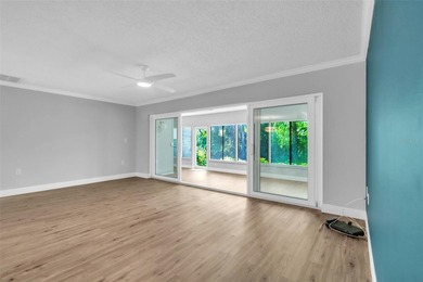 This beautifully updated 3-bedroom, 2-bath single-family home is on East Lake Woodlands Country Club in Florida - for sale on GolfHomes.com, golf home, golf lot