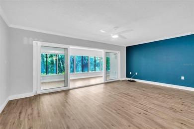 This beautifully updated 3-bedroom, 2-bath single-family home is on East Lake Woodlands Country Club in Florida - for sale on GolfHomes.com, golf home, golf lot