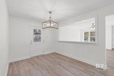 Freshly redesigned with today's sleek finishes and a warm on The Golf Club of the Wharf in Alabama - for sale on GolfHomes.com, golf home, golf lot