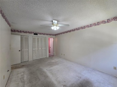2nd floor condo located in the 55+ community of Live Oak Village on Country Club At Silver Springs Shores in Florida - for sale on GolfHomes.com, golf home, golf lot