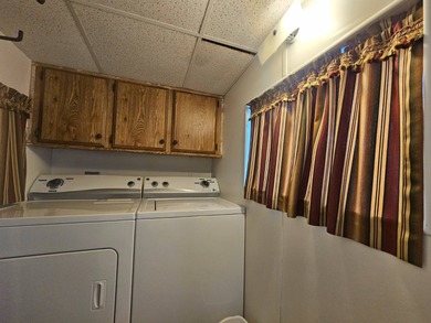 This charming 1-bedroom, 1.5-bathroom home with an Arizona room on Viewpoint Golf Resort in Arizona - for sale on GolfHomes.com, golf home, golf lot