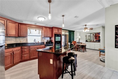 Live the dream in this beautifully updated 2BR/2BA home in on Barefoot Bay Golf Course in Florida - for sale on GolfHomes.com, golf home, golf lot