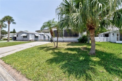 Live the dream in this beautifully updated 2BR/2BA home in on Barefoot Bay Golf Course in Florida - for sale on GolfHomes.com, golf home, golf lot