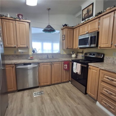 A great location for year-round or seasonal use. Within walking on Barefoot Bay Golf Course in Florida - for sale on GolfHomes.com, golf home, golf lot