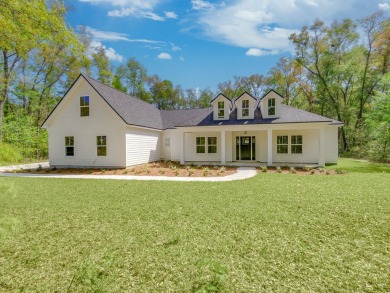 Exquisite new construction overlooking hole 6 of the new, state on Wildwood Country Club in Florida - for sale on GolfHomes.com, golf home, golf lot