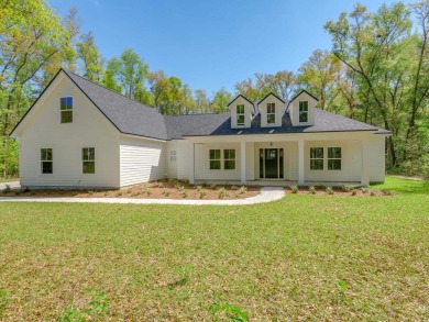 Exquisite new construction overlooking hole 6 of the new, state on Wildwood Country Club in Florida - for sale on GolfHomes.com, golf home, golf lot