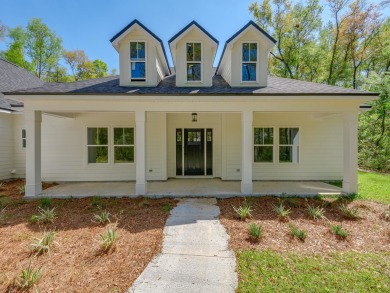 Exquisite new construction overlooking hole 6 of the new, state on Wildwood Country Club in Florida - for sale on GolfHomes.com, golf home, golf lot
