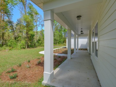 Exquisite new construction overlooking hole 6 of the new, state on Wildwood Country Club in Florida - for sale on GolfHomes.com, golf home, golf lot