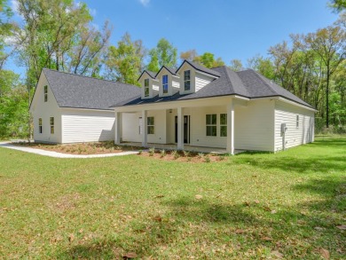 Exquisite new construction overlooking hole 6 of the new, state on Wildwood Country Club in Florida - for sale on GolfHomes.com, golf home, golf lot