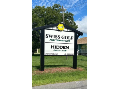 Welcome to your serene sanctuary nestled on an exterior lot of on Lake Henry Golf Club in Florida - for sale on GolfHomes.com, golf home, golf lot