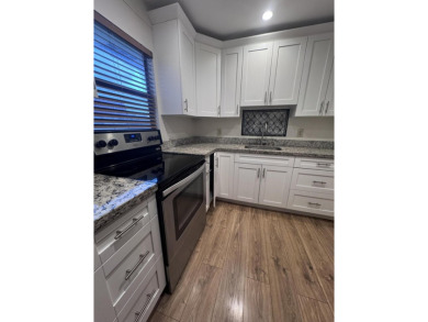 Two-bedroom, 2 bath, end unit villa in the Seville section of on Kings Point Golf - Executive in Florida - for sale on GolfHomes.com, golf home, golf lot