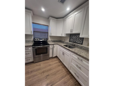Two-bedroom, 2 bath, end unit villa in the Seville section of on Kings Point Golf - Executive in Florida - for sale on GolfHomes.com, golf home, golf lot