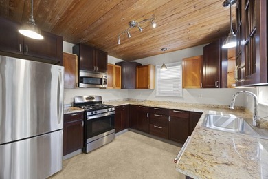 Key West style Cottage in the heart of the Parrot Cove on Lake Worth Municipal Golf Course in Florida - for sale on GolfHomes.com, golf home, golf lot