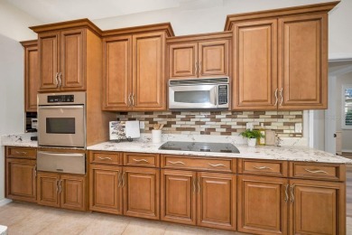 Under contract-accepting backup offers. Exquisite Luxury Retreat on Tarpon Woods Golf Club in Florida - for sale on GolfHomes.com, golf home, golf lot