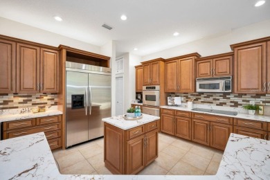 Under contract-accepting backup offers. Exquisite Luxury Retreat on Tarpon Woods Golf Club in Florida - for sale on GolfHomes.com, golf home, golf lot