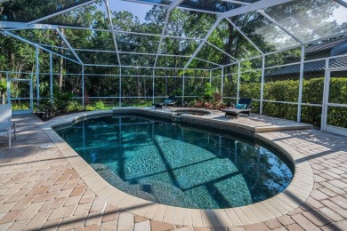 Under contract-accepting backup offers. Exquisite Luxury Retreat on Tarpon Woods Golf Club in Florida - for sale on GolfHomes.com, golf home, golf lot